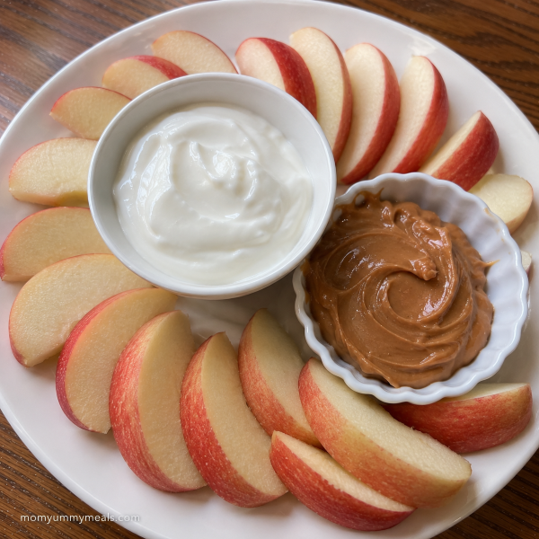 Apple slices with peanut butter and plain Greek yogurt for an easy snack