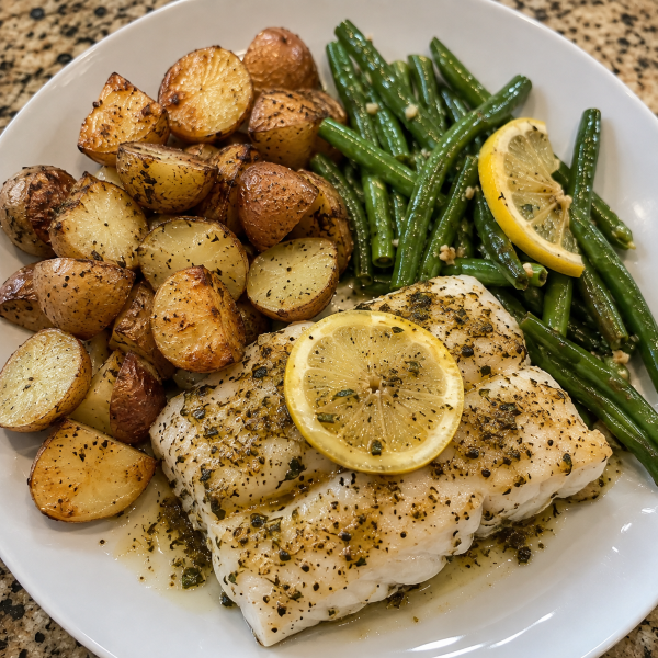 Baked Cod: Baked cod with green beans lemon and roasted baby potatoes