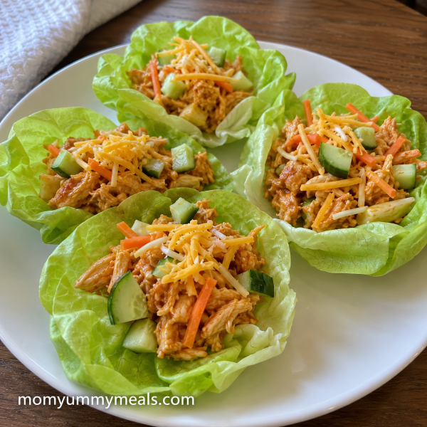 Buffalo chicken lettuce cups with cucumber carrots and cheese