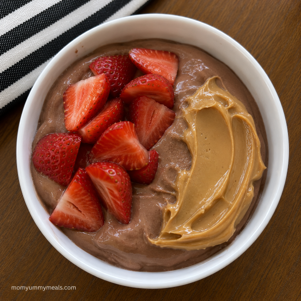 Chocolate Greek yogurt bowl with strawberries and peanut butter