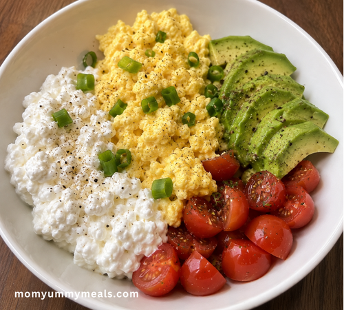 cottage cheese breakfast bowl with eggs avocado and tomatoes