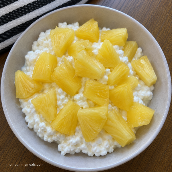 Cottage cheese bowl topped with fresh pineapple