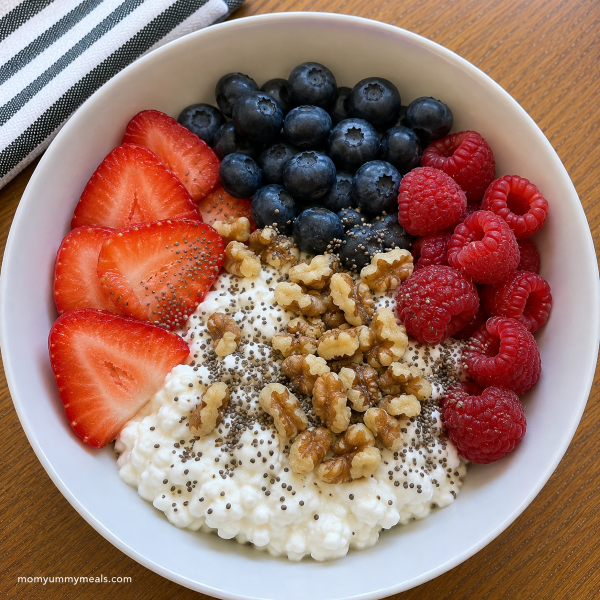 Cottage cheese bowl with berries walnuts and chia seeds