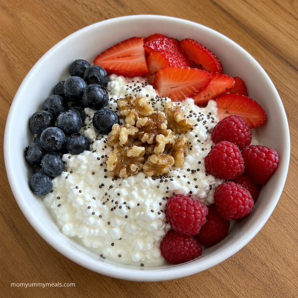 Cottage cheese breakfast bowl with fresh berries walnuts and chia seeds