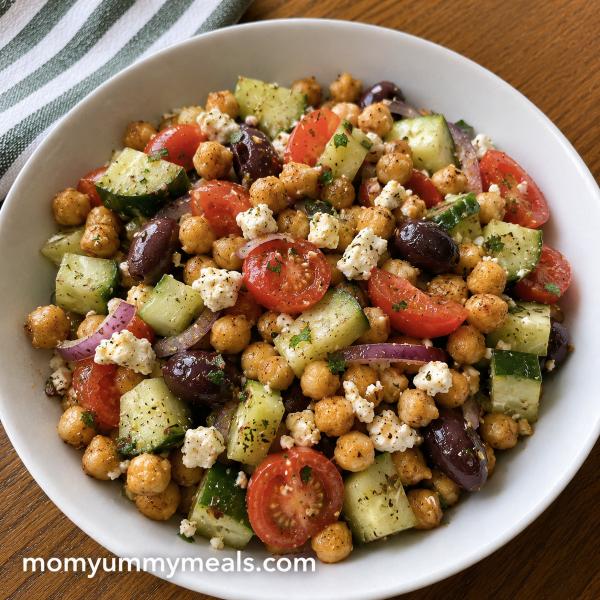 Crispy chickpea Greek salad with cucumber tomatoes feta and olives