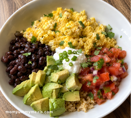 breakfast bowl with black beans avocado salsa and scrambled eggs