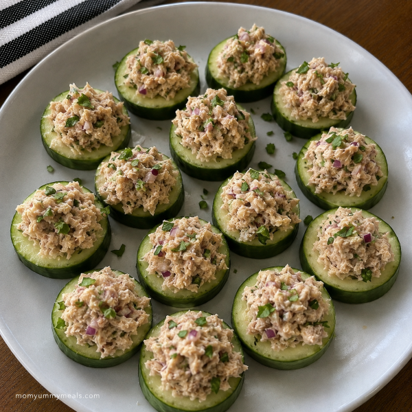 Fresh cucumber rounds topped with tuna and herbs