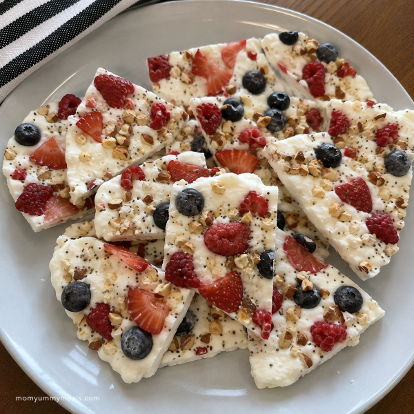 Greek yogurt frozen bark topped with berries and chopped nuts
