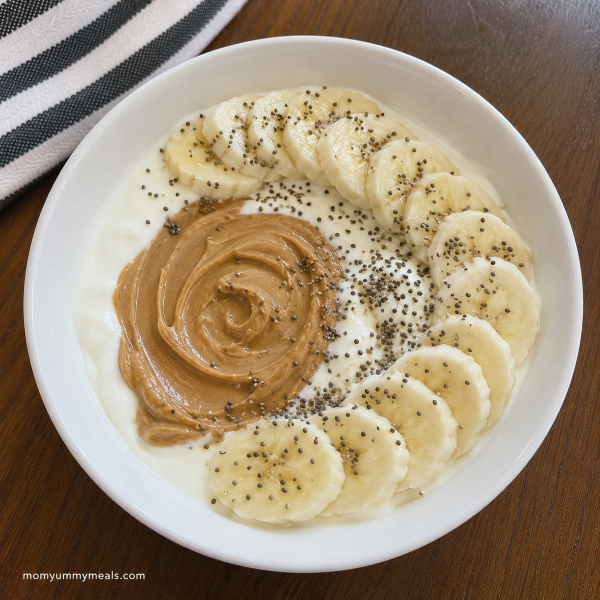 Greek yogurt peanut butter bowl with banana and chia seeds