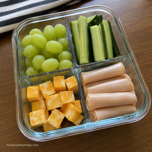 High protein snack box with turkey cheese grapes and vegetables
