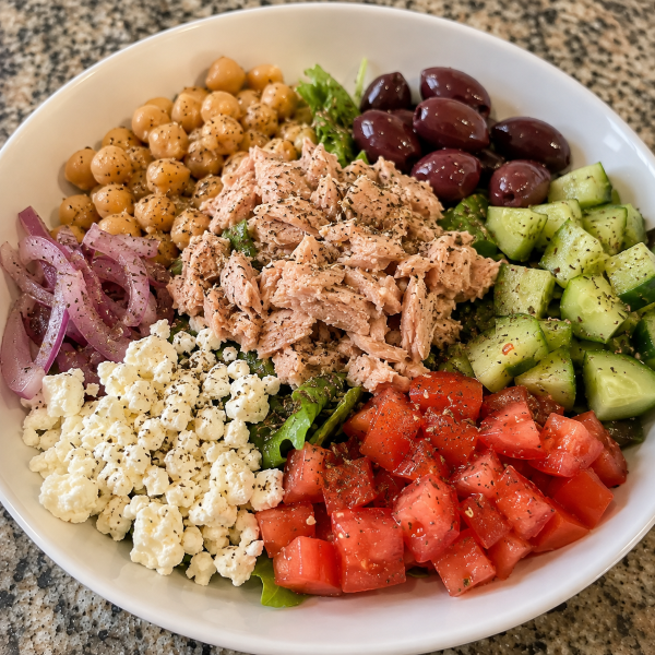 Mediterranean tuna bowl with chickpeas cucumber tomatoes olives and feta