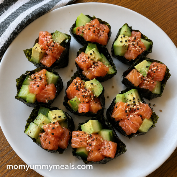Salmon cucumber avocado nori bites with sesame seeds