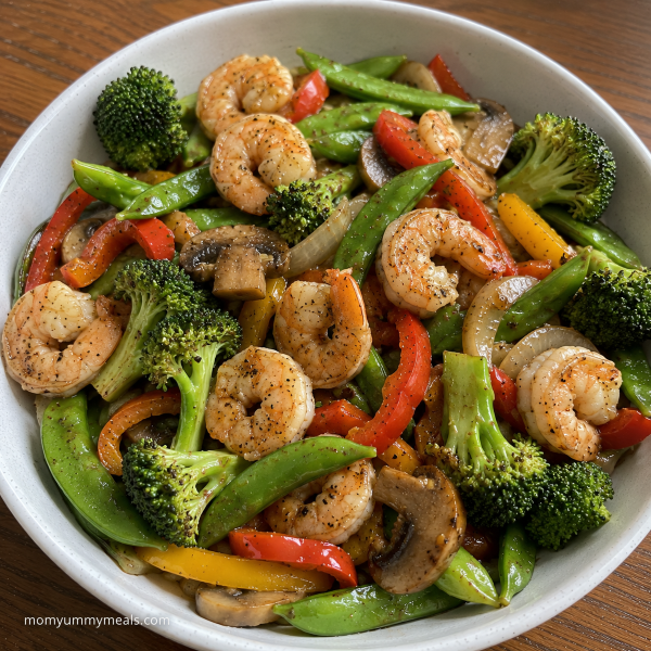 Shrimp vegetable stir fry with broccoli mushrooms peppers and snap peas
