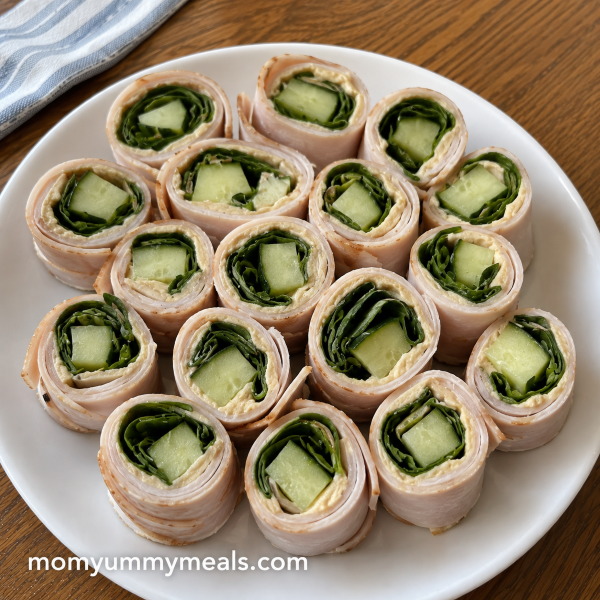Turkey cucumber roll ups with spinach and hummus