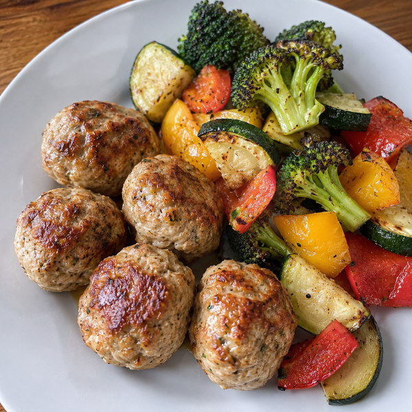 Turkey meatballs with roasted broccoli zucchini and bell peppers